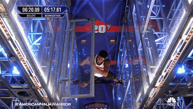a man is jumping through a glass door in a video for american in a warrior