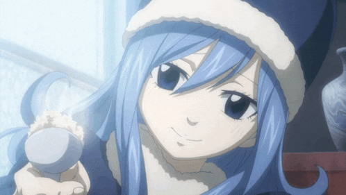 a girl with blue hair is wearing a hat