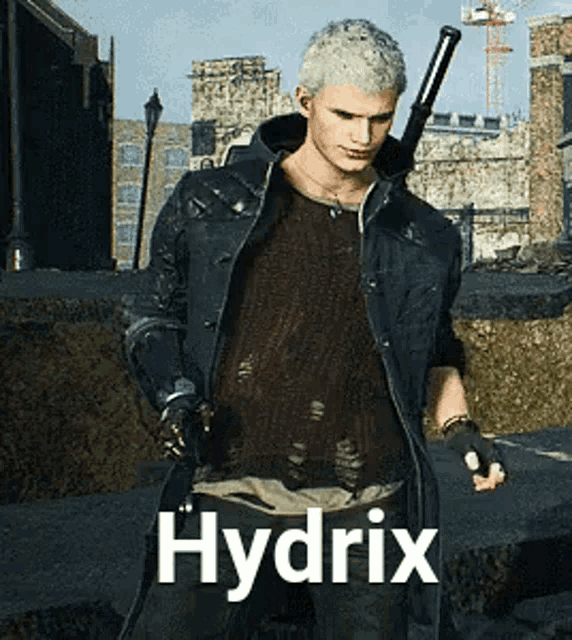 a man in a black jacket is holding a gun and the word hydrix is above him