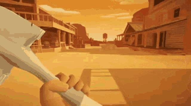 a person is holding a shovel in front of a town