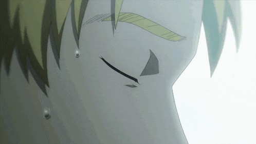 a close up of a person 's face with tears coming out of it