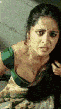 a close up of a woman 's face with the letter b on the bottom left