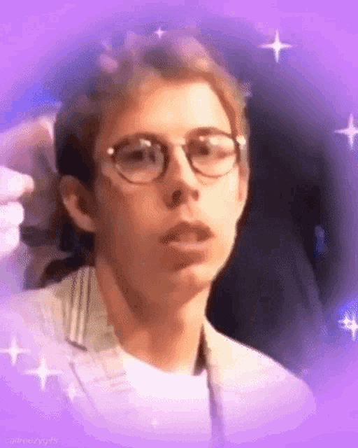 a close up of a man wearing glasses with a purple background