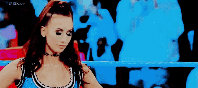 a woman in a wrestling ring with the hashtag #sdcraw on the bottom left