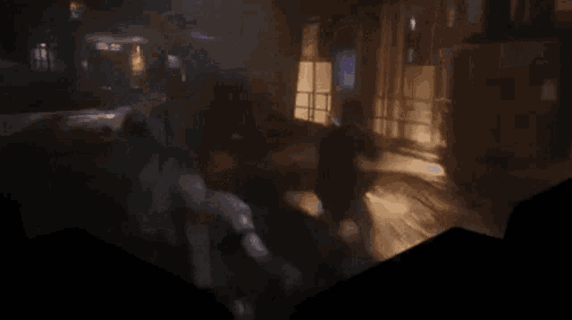 a video game scene with a man holding a gun and a crate that says ' cargo ' on it