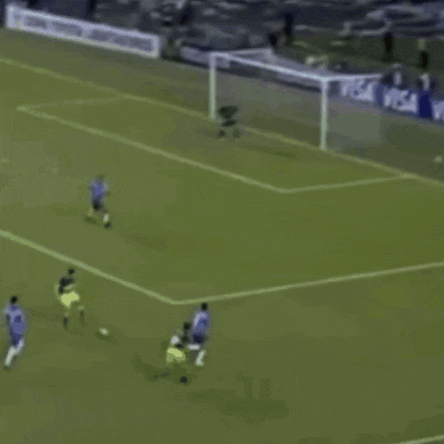 a soccer game is being played in front of a visa sign