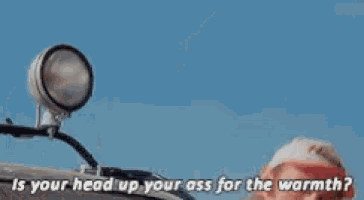 a man in a red hat says " is your head up your ass for the warmth ? "