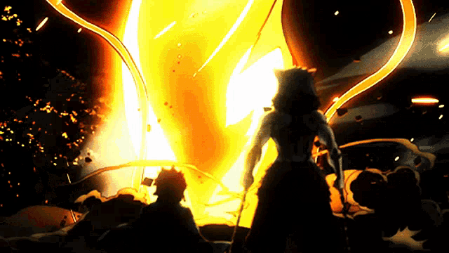 a man and woman standing in front of a large fire