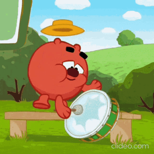 a cartoon character is playing a drum in a field
