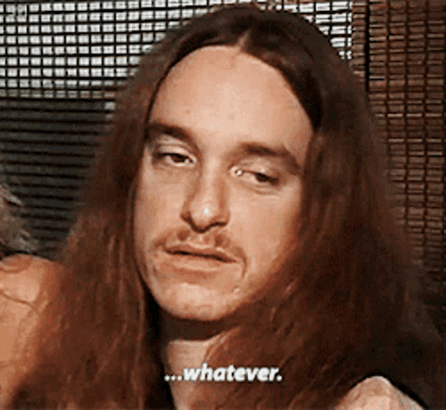 a man with long hair and a moustache says whatever