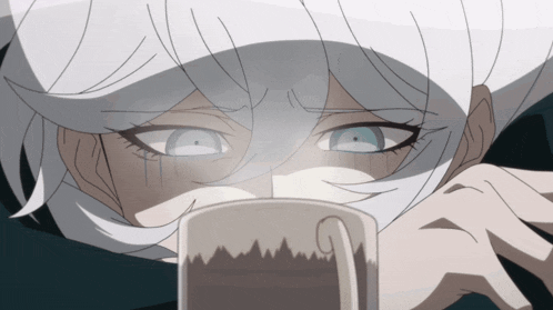 a close up of a person 's face with a mug in front of it