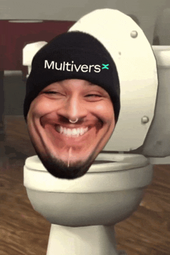 a man wearing a black hat with the word multivers on it is sitting on a toilet