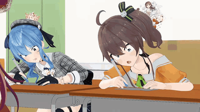 a girl with blue hair is sitting at a desk next to a girl with brown hair