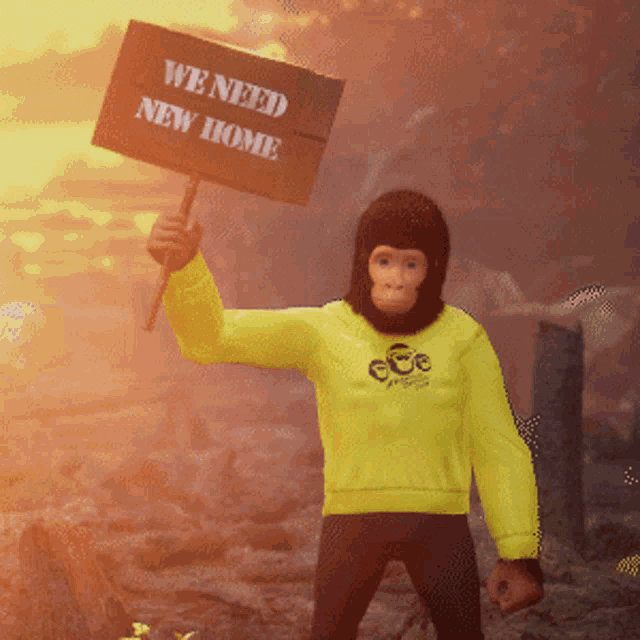a monkey wearing a yellow shirt holds up a sign that says we need new home