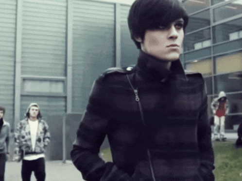 a man in a black jacket has a zipper on the side of his jacket