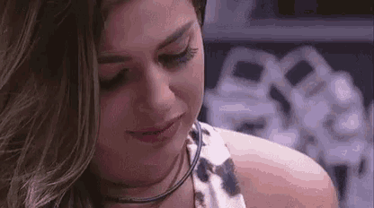 a close up of a woman 's face with tears running down her face .