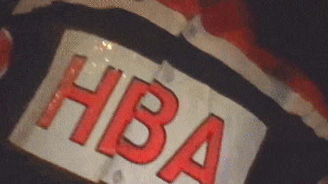 a close up of a sign that says hba in red letters