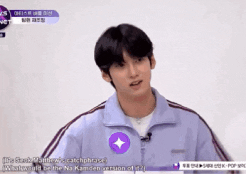a man in a purple jacket is making a catchphrase