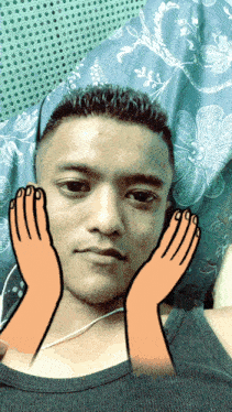 a man laying on a bed with his hands on his face and a drawing of hands on his face