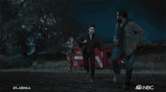 a group of people running in a field with the nbc logo on the bottom right