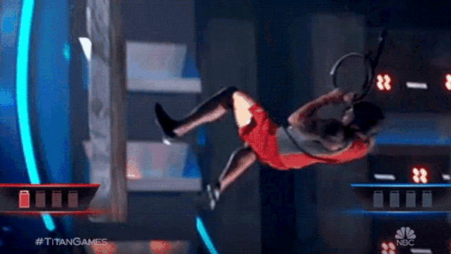 a man is falling in the air while holding a tennis racquet .