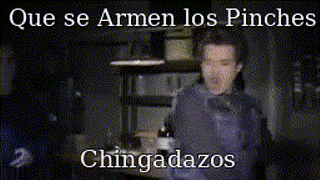 a blurry picture of a man with the words que se armen los pinches chingadazos below him