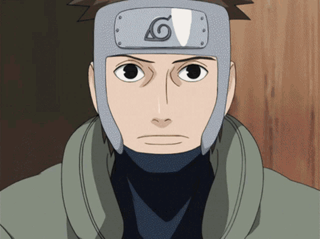 a close up of a person wearing a headband with a letter g on it