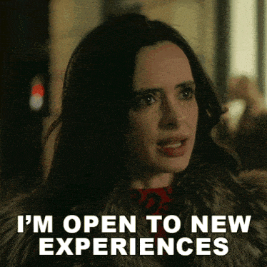 a woman wearing a fur coat says i 'm open to new experiences