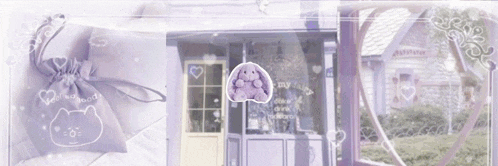 a purple bag with a cat on it is sitting in front of a building