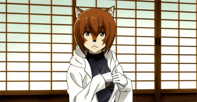 a girl with a cat 's head and ears is standing in front of a window