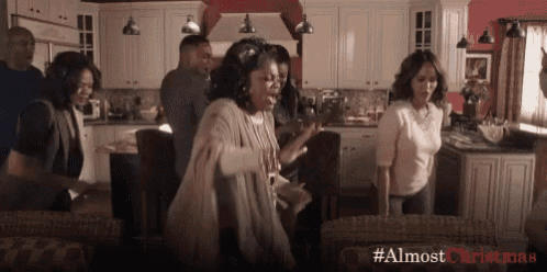 a group of people are dancing in a living room with the hashtag #almostchristmas