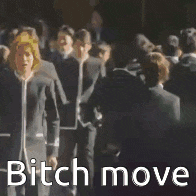 a group of people in suits are walking in a line and the words bitch move are on the screen .