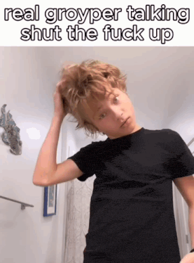 a young boy in a black shirt is holding his hair and the caption reads real groyper talking shut the fuck up