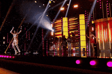 a woman in white thigh high boots is on a stage