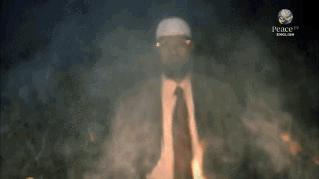 a man in a suit and tie is surrounded by smoke and says peace in english on the bottom