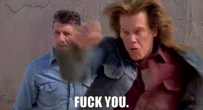 two men with beards are standing next to each other and one of them is giving the other a fist bump .