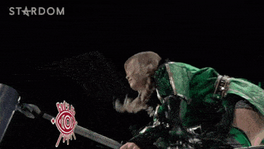 a woman in a green outfit with the name ami sourei