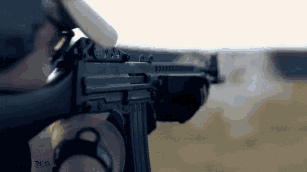 a close up of a person holding a rifle with a sticker on it that says ' d.s.c. '