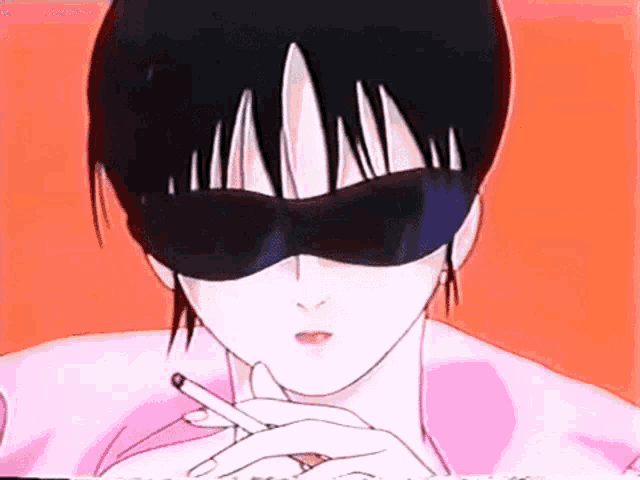 a person wearing sunglasses is holding a cigarette in their hand