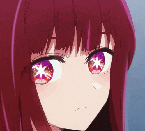 a close up of a girl 's eyes with a star in them