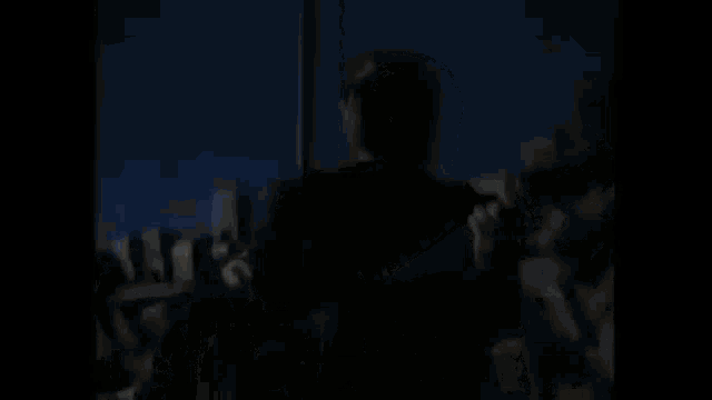 a man playing a guitar with the words " ain t it funny how the night moves " below him