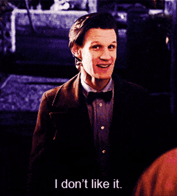 a man in a suit and bow tie is saying i don 't like it