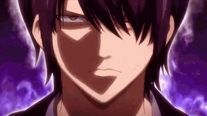 a close up of a person 's face with purple hair and a shadow on it .