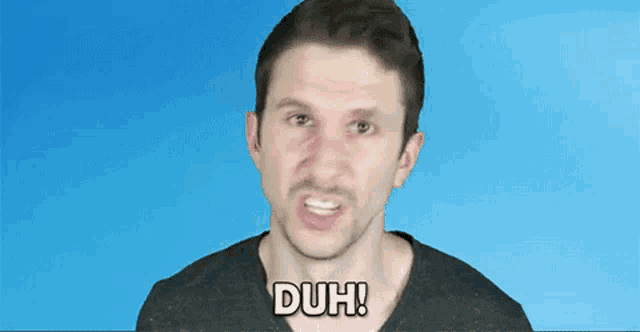 a man is making a funny face and the word duh is on the screen