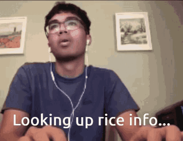 a man wearing ear buds and a blue shirt says " looking up rice info "