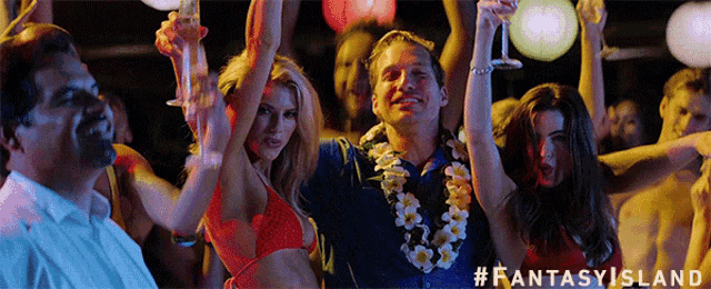 a group of people at a party with #fantasyisland at the bottom