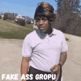 a man wearing a wig and a white shirt with the words fake ass gropu on the bottom