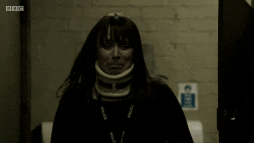 a woman is wearing a neck brace and a lanyard that says police