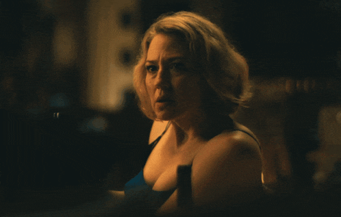 a woman in a blue tank top with the word right written below her