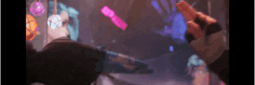 a person is holding a gun in a blurry video game scene .